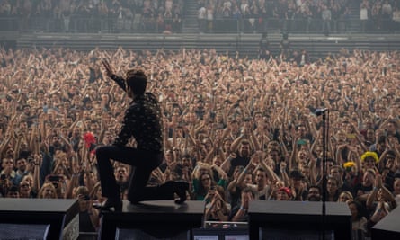 The Killers perform in Melbourne in 2018. Benita Kolovos can be seen in the crowd dressed in blue, to the left of Brandon Flowers’ hand