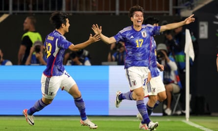 Ao Tanaka celebrates after heading a fourth goal for Japan