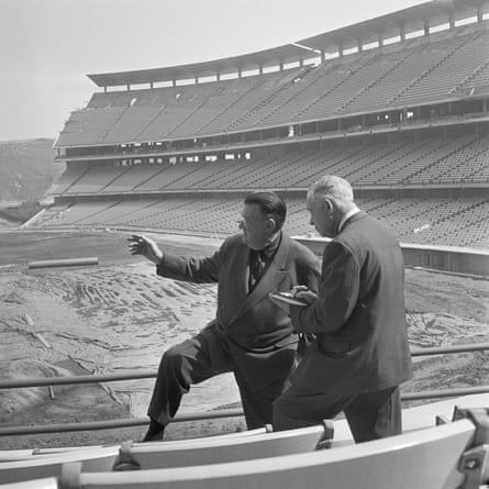 Walter F. O’Malley, left, describes features of his lavish new baseball stadium in Chavez Ravine, to sports editor Curly Grieve of the San Francisco Examiner, Feb. 22, 1962.