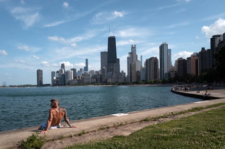 person sitting and facing lake