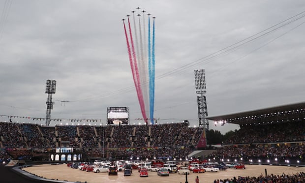 Red, white and blue cars arranged in shape of union jack