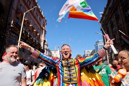 A man wearing rainbow-striped clothes at Budapest Pride 2025.