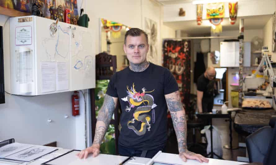 Tattooist Stewart Ferguson in his tattoo parlour in north London.
