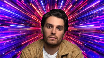 A dark-haired man in a light jacket