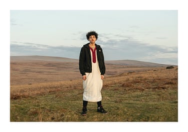 Jounaid, Go Back To Where? Dartmoor National Park by Jaiyana Chelikha ‘Go Back to Where? explores identity and belonging through the lens of second-generation immigrants. The subject, half-Moroccan and half-French, was born and raised in the UK, yet his identity is often questioned. Shot against the vast British moors, a landscape deeply tied to national identity, he wears a gandoura, a traditional Moroccan garment. This contrast represents the duality of his experience, balancing heritage with the reality of growing up in Britain’