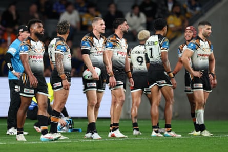 Adam Doueihi and Wests Tigers teammates look dejected during their NRL clash with the Parramatta Eels