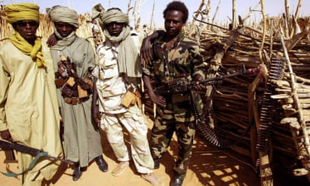 Rebels fighting Sudanese troops pose in 2004 during an intense period of fighting during the civil war.