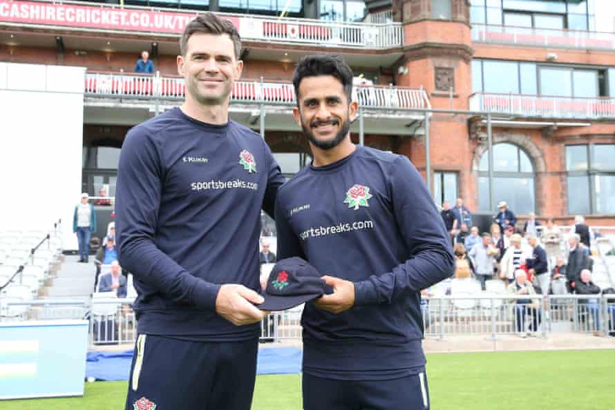 Lancashire’s James Anderson presents Hassan Ali with his county cap at Old Trafford