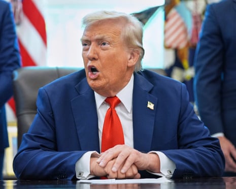 Donald Trump signing executive orders in the Oval Office on Monday.