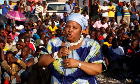 Nosiviwe Mapisa-Nqakula holds a microphone and speaks to a crowd.