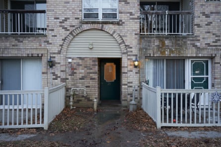 entrance with puddle and leaves in front of door