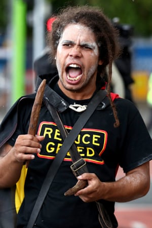 Derek Sandy leads a march during an Invasion Day rally in Brisbane.