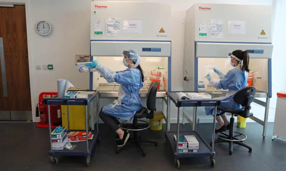 Scientist assess Covid-19 tests at a lab in Glasgow.