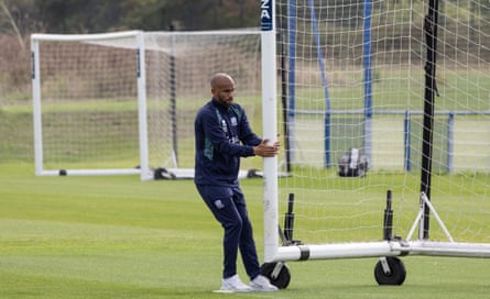 The Southend manager, Kieron Dyer, moves a goalframe before a training session.