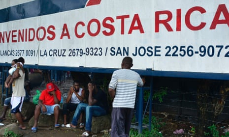 Migrants by a banner that reads ‘Welcome to Costa Rica’ in an encampment of Africans in Peñas Blancas, Guanacaste, Costa Rica, on the border with Nicaragua last month.