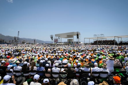 A huge crowd is seated under a blue sky as Pope Leo presides over mass at the Port of Santa Cruz de Tenerife on Friday.