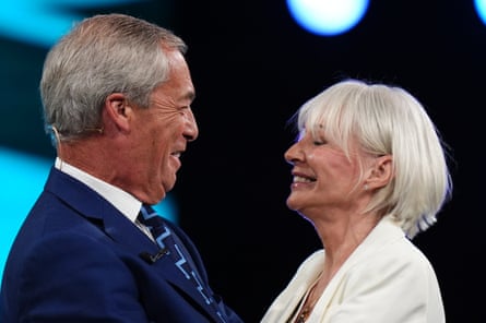 Nadine Dorries joins Nigel Farage on stage.