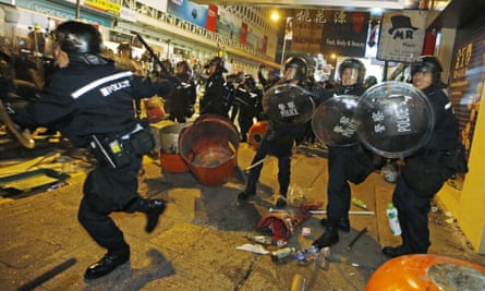 Chaos … riot police in the Mong Kok district of Hong Kong.
