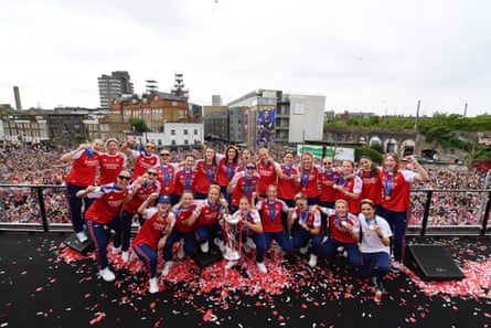 The Arsenal players and their head coach Renée Slegers, (bottom row, right) pose for a photo with the Women’s Champions League trophy during celebrations at Emirates Stadium