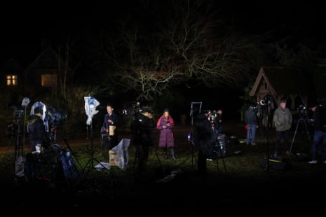 Members of the media stood outside during the evening.