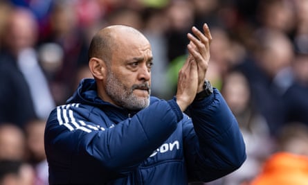 Nuno Espírito Santo applauds his side's supporters before playing Manchester City