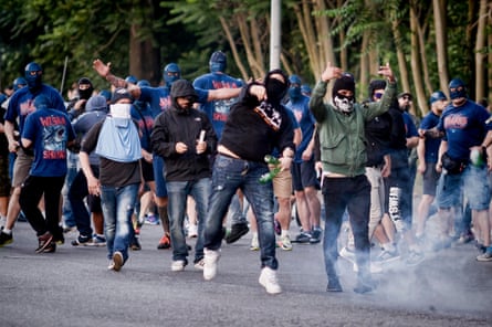 SS Lazio ultras clash with riot police at the end of the Serie A match between SS Lazio and AS Roma in 2015.