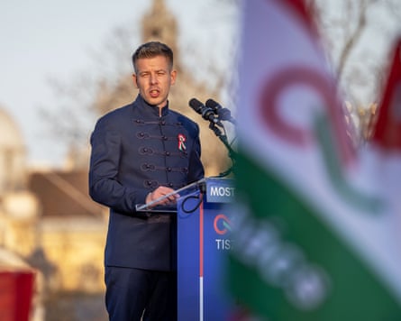 Peter Magyar making a speech from a lectern outdoors