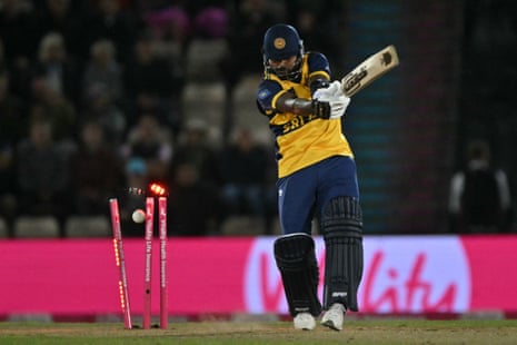 Sri Lanka's Wanindu Hasaranga loses his wicket off the bowling of England's Jamie Overton.