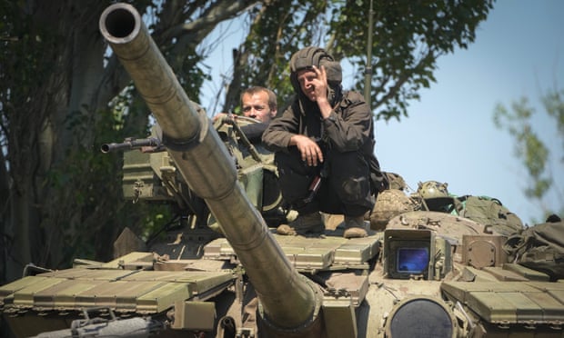 A Ukrainian soldier flashes the victory sign atop a tank in Donetsk region, Ukraine, on Monday 20 June as Russia’s war on Ukraine continues.