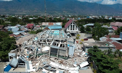 This aerial picture shows the remains of a ten-storey hotel in Palu after it collapsed following a strong earthquake