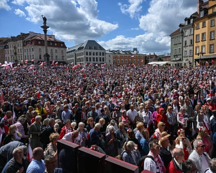 Nawrocki supporters gather near St John’s Archcathedral in Warsaw’s old town during a mass after the swearing-in ceremony.