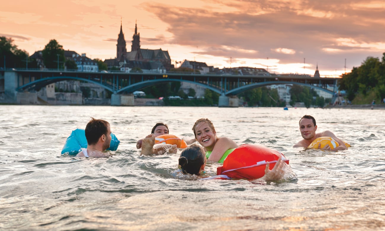 A group of male and female swimmers in the Rhine River, Basel, Switzerland.