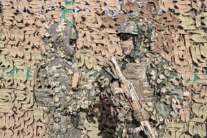 Donguz, Russia: Servicemen display military camouflage equipment during the joint military anti-terrorist command and staff exercise of the armed forces of the Shanghai Cooperation Organization member states Peace Mission, in the Orenburg region. More than three thousand servicemen from Russia, India, China, Pakistan, Tajikistan, Uzbekistan, Kazakhstan, Kyrgyzstan and more than 600 units of weapons, military and special equipment are involved in the exercise