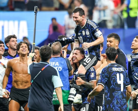 Argentina players celebrate with Lionel Messi after their World Cup semi-final win over England