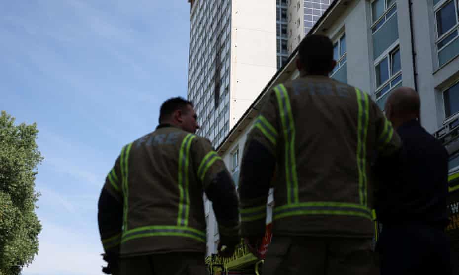 Firefighters at the tower block in Queensdale Crescent, London.