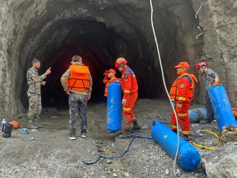 Soldiers at the mouth of a tunnel