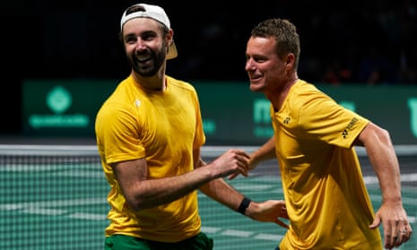 Australia captain Lleyton Hewitt and player Jordan Thompson celebrate victory in the Davis Cup quarter-final against Netherlands.
