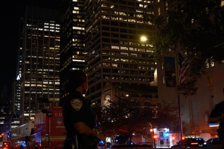person in uniform in front of city landscape