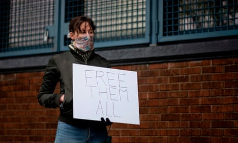 A woman takes part in a vigil outside Queensboro correctional facility in New York City on 23 April. 