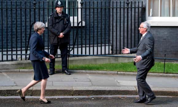 Theresa May greeting Jean-Claude Juncker outside No 10