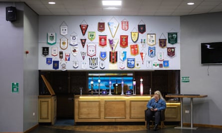 Pennants on the wall above the bar at TNS's stadium.