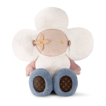 A weird cuddly toy with LV logo’ed fabric on its feet and a giant pink-and-white flower for a head