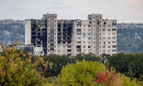 Blocks of blackened flats stand half abandoned in Saltivka district, Kharkiv, after months of Russian bombardment.