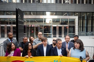 a woman speaks outside a building