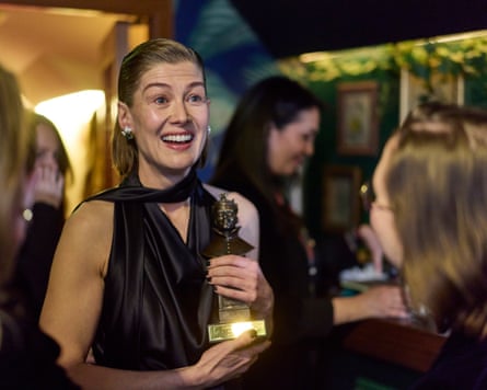 Rosamund Pike holding a trophy