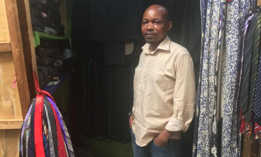 Rutayisire Ibrahim, a trader at Biryogo market in Kigali, sells secondhand men’s trousers, suits and ties.
