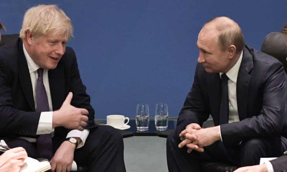 Boris Johnson meets Vladimir Putin at a peace summit on Libya in Berlin, January 2020