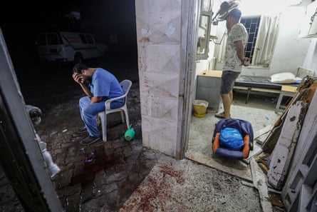 A doctor at Al-Ahli hospital in Gaza City after an airstrike in October 2023.