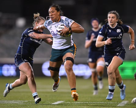 Siokapesi Palu makes a break through the Scotland defence to score a try