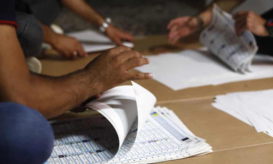 Election officials count ballots in Baghdad